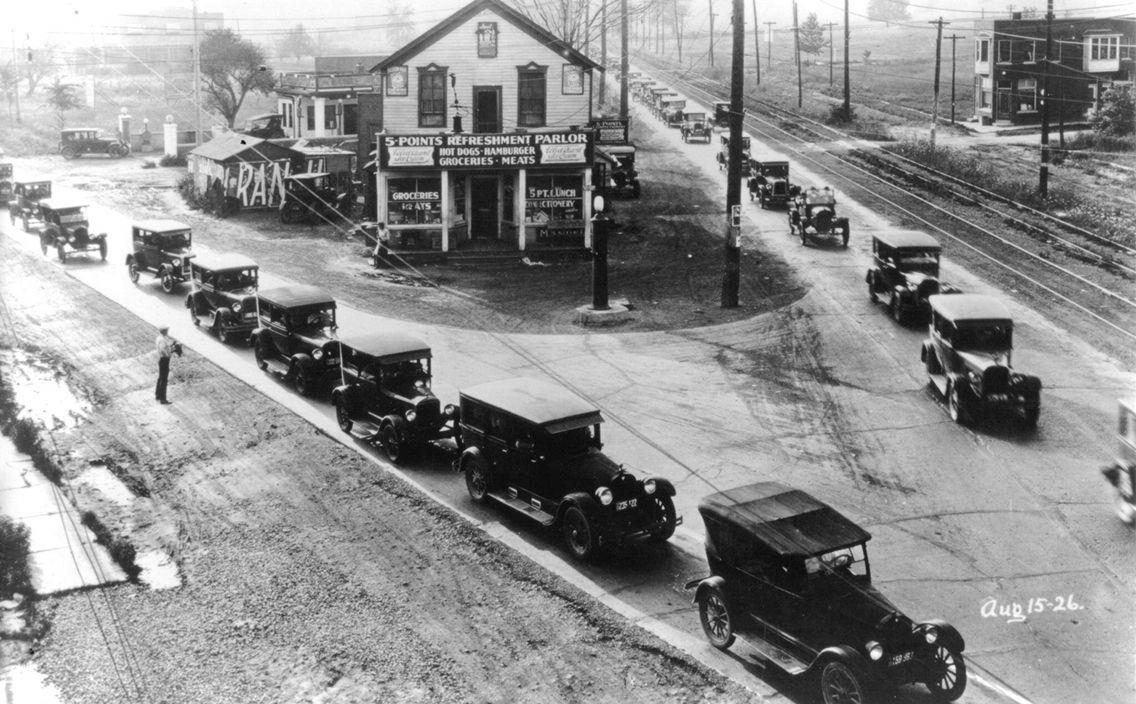 A long line of Ford Model Ts outside the 5-Points Refreshment Parlor at the intersection of 7 Mile Road and Gr