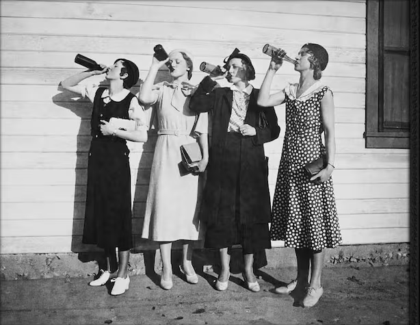 Four young women defiantly drink during Prohibition, 1925