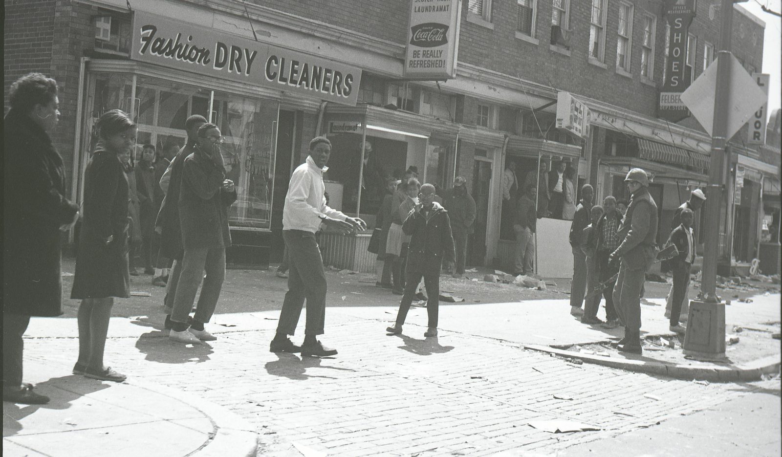 Residents confront Marines outside damaged shops